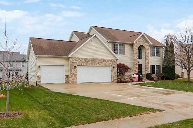 view of front facade with a garage and a front yard