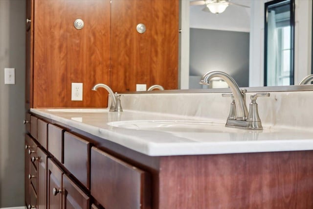 bathroom featuring ceiling fan and vanity