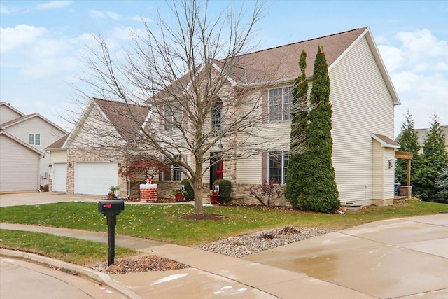 view of front of house with a front yard and a garage