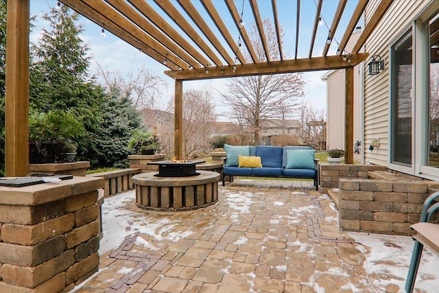 view of patio / terrace featuring a pergola and an outdoor living space with a fire pit