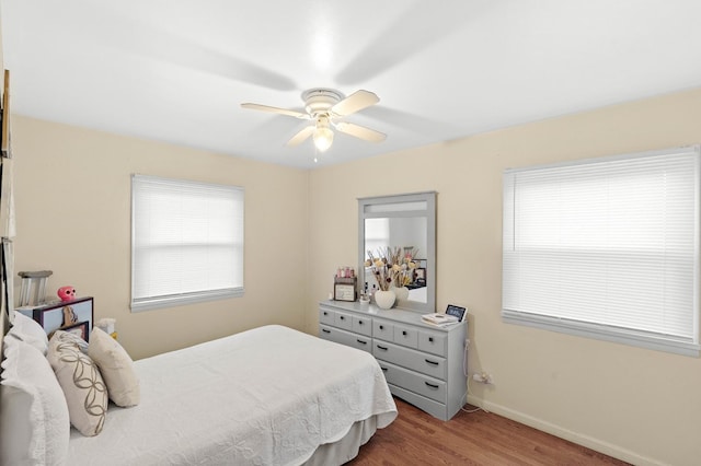 bedroom featuring hardwood / wood-style floors and ceiling fan