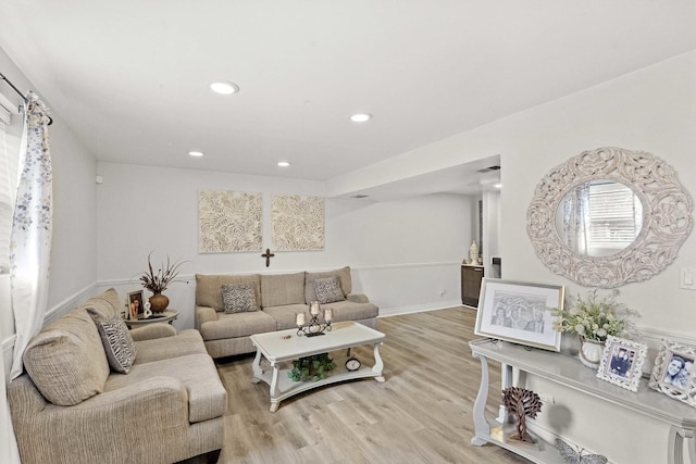 living room with light hardwood / wood-style flooring