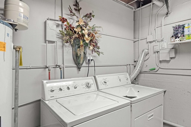 clothes washing area featuring washing machine and dryer