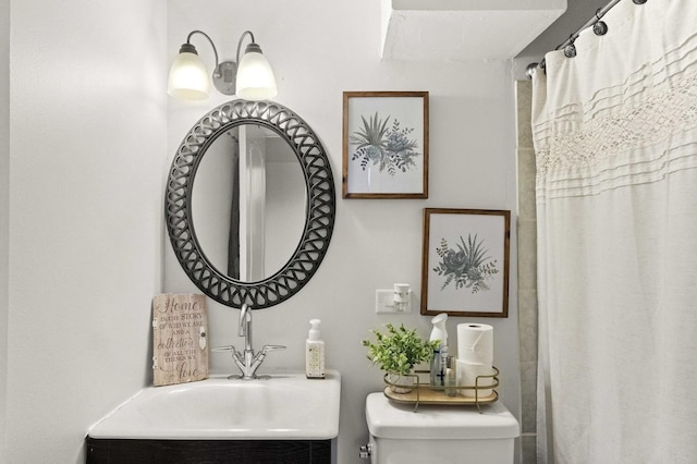 bathroom featuring vanity and toilet