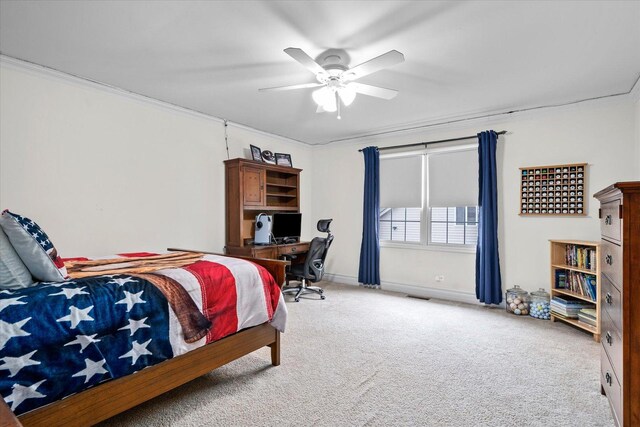 bedroom with ceiling fan, light carpet, visible vents, baseboards, and ornamental molding