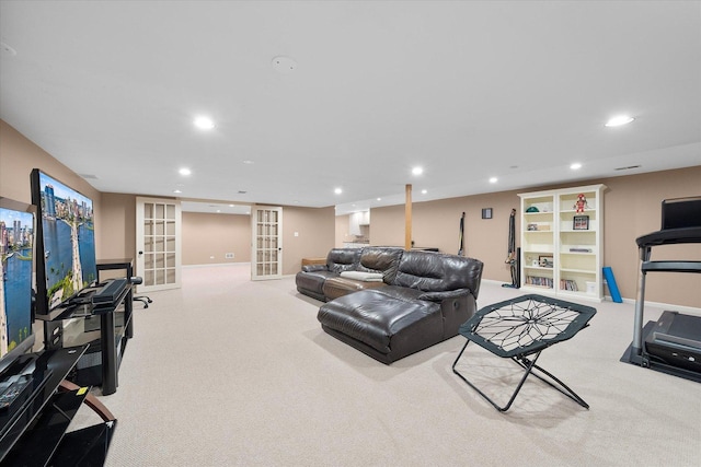 carpeted living area with recessed lighting, french doors, and baseboards