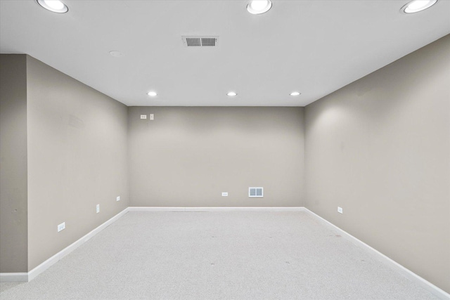 unfurnished room with baseboards, carpet, visible vents, and recessed lighting