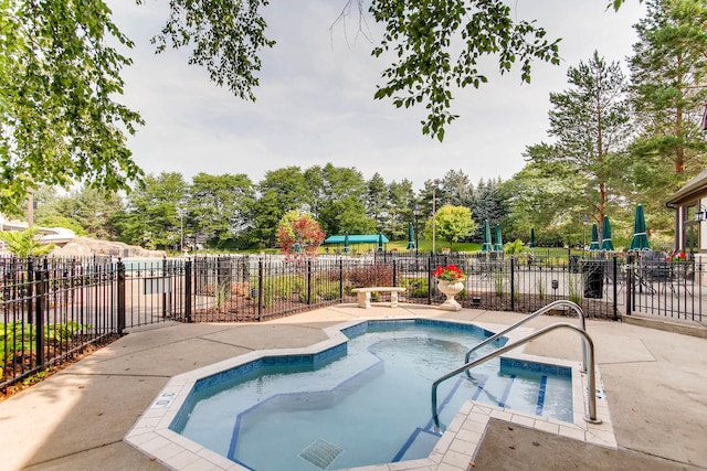 view of swimming pool featuring fence and a pool