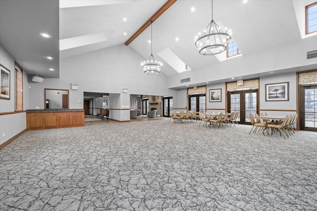 interior space featuring an inviting chandelier, carpet, visible vents, and french doors