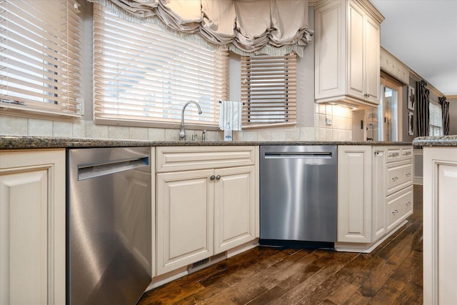 kitchen featuring dishwasher, a sink, and dark wood-style floors