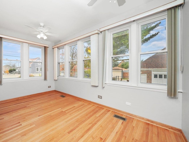 unfurnished sunroom featuring plenty of natural light