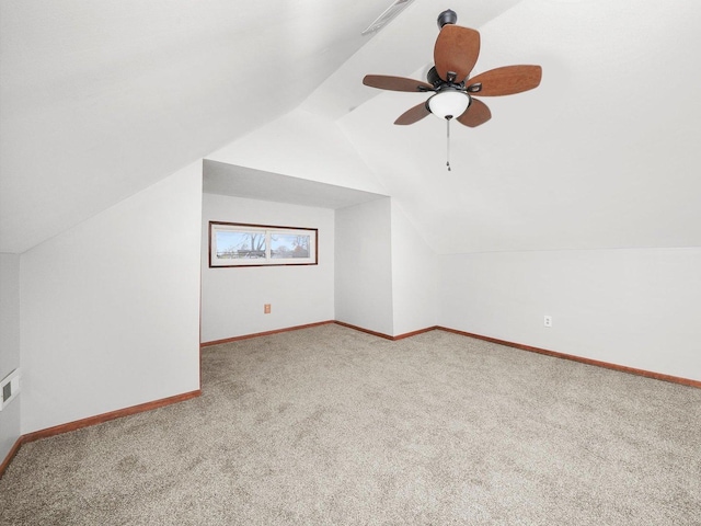 bonus room with ceiling fan, carpet floors, and vaulted ceiling