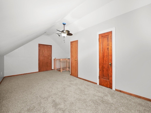 bonus room with carpet floors, ceiling fan, and lofted ceiling