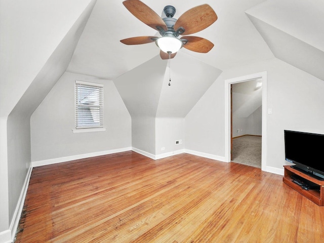 bonus room with hardwood / wood-style floors, ceiling fan, and lofted ceiling