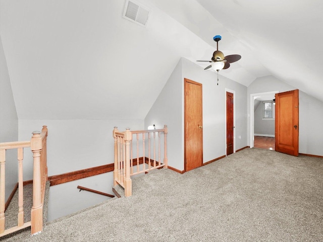 bonus room featuring light carpet, vaulted ceiling, and ceiling fan