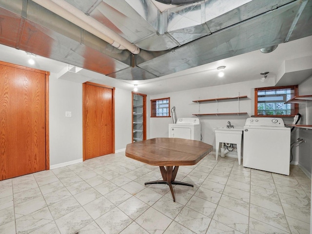 interior space featuring washing machine and dryer and sink