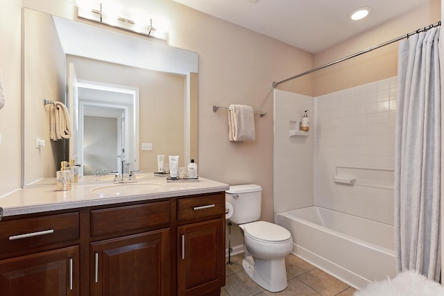 full bathroom with tile patterned flooring, shower / bath combination with curtain, vanity, and toilet