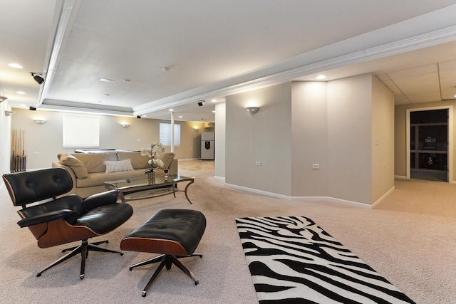 carpeted living room featuring crown molding