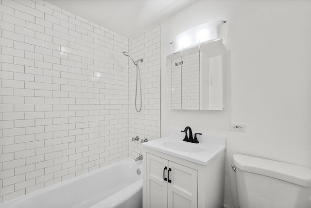 full bathroom with vanity, toilet, and tiled shower / bath