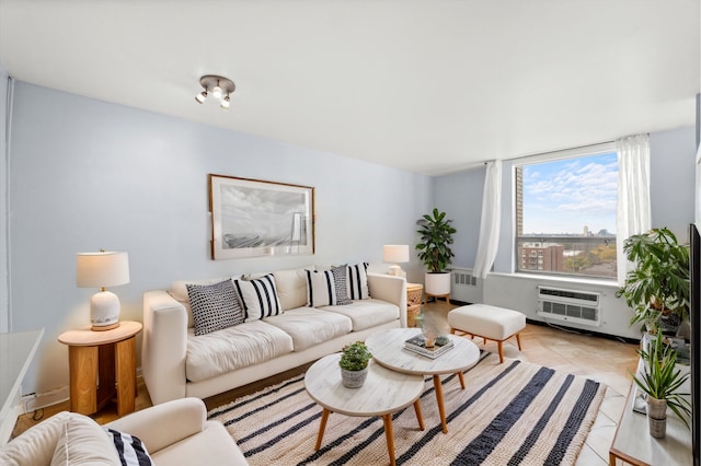 living room with a wall unit AC, radiator, and light tile patterned floors