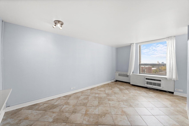 unfurnished room with an AC wall unit and radiator