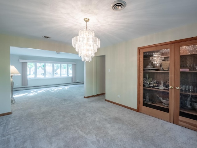 carpeted empty room with a chandelier and a baseboard radiator