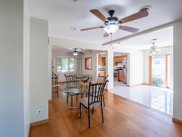 dining area featuring ceiling fan and light hardwood / wood-style flooring