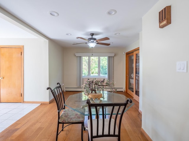 dining area with light hardwood / wood-style floors and ceiling fan