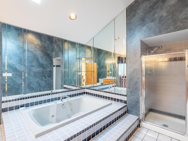 bathroom featuring tile patterned flooring and separate shower and tub