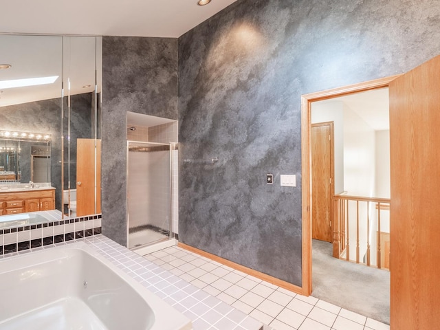 bathroom featuring vanity, lofted ceiling, and plus walk in shower