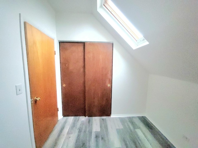 bathroom with tile patterned flooring and a shower with door