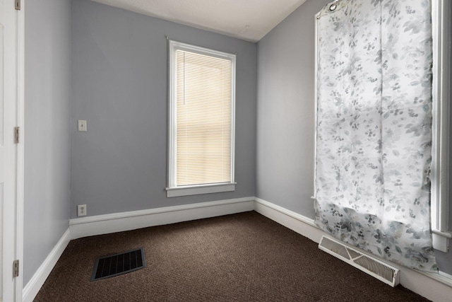 empty room featuring carpet flooring