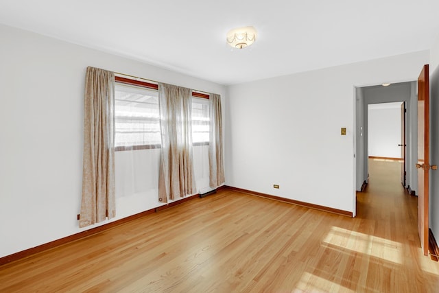 spare room with light wood-type flooring