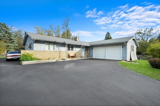 single story home featuring a garage