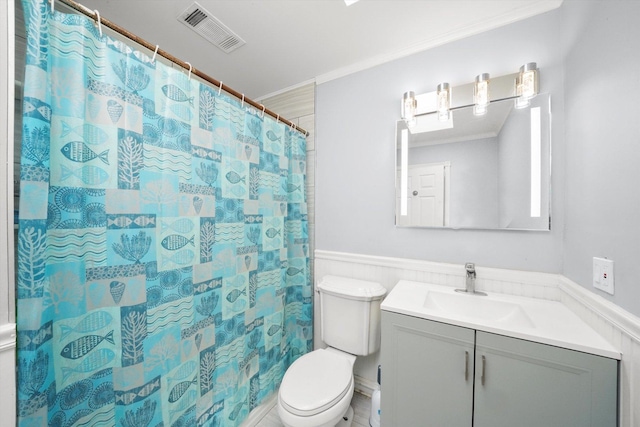 bathroom with a shower with curtain, vanity, toilet, and ornamental molding