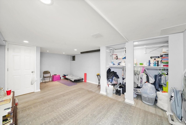 basement featuring light hardwood / wood-style flooring