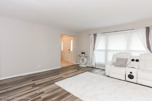 living room with dark hardwood / wood-style floors