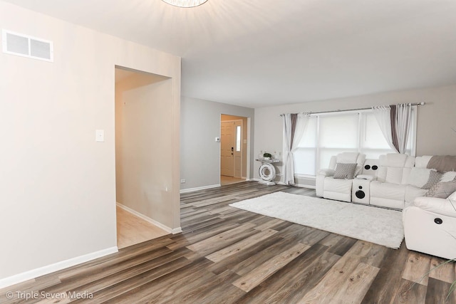 unfurnished living room featuring hardwood / wood-style floors