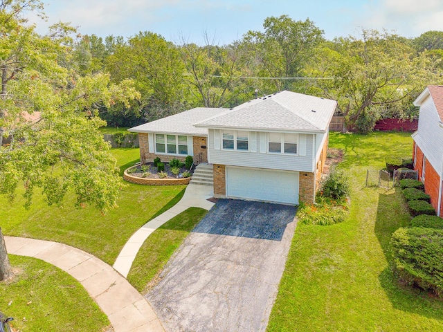 view of front of home with a garage and a front yard