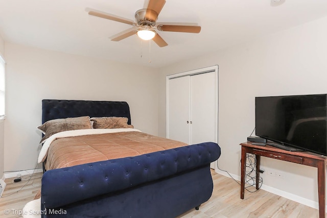 bedroom featuring a closet, hardwood / wood-style flooring, and ceiling fan