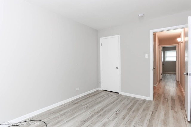 unfurnished room featuring light hardwood / wood-style floors