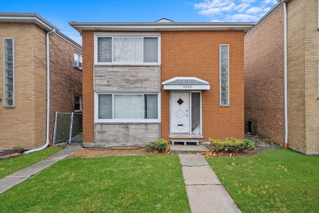 view of front of home with a front lawn