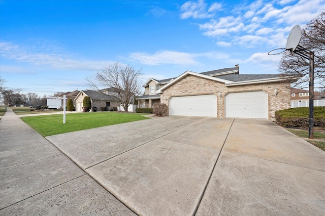 view of front of house featuring a garage and a front yard