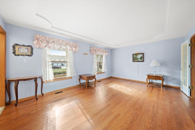 sitting room with light hardwood / wood-style flooring