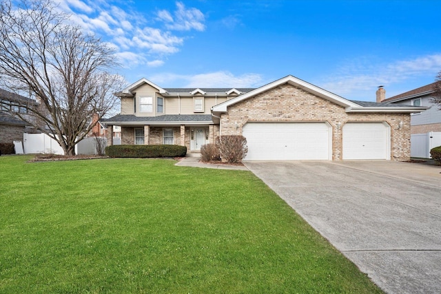 view of front of house with a front yard and a garage