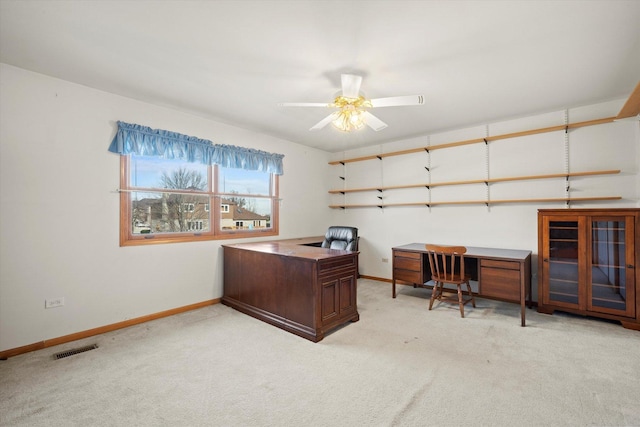 office space featuring light colored carpet and ceiling fan