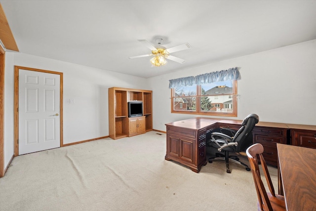 office area with light colored carpet and ceiling fan