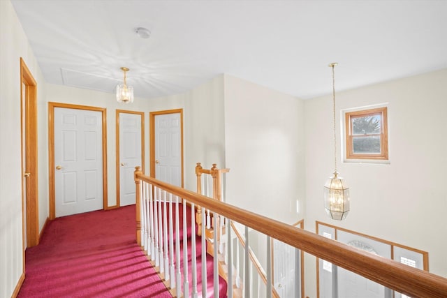 hallway featuring carpet