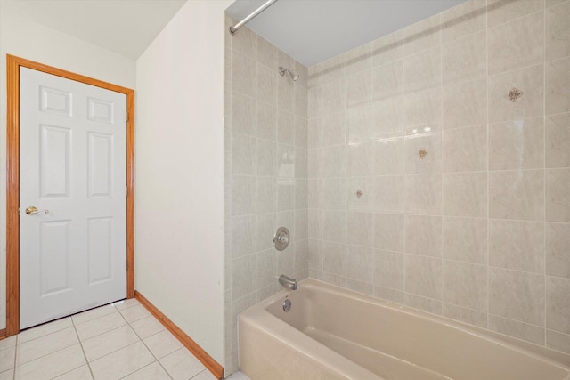 bathroom with tile patterned flooring and tiled shower / bath