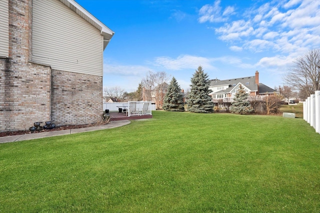 view of yard featuring a wooden deck